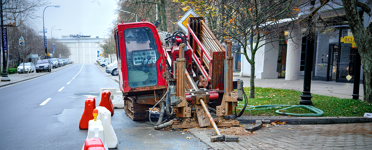 red deilling machine parked road side