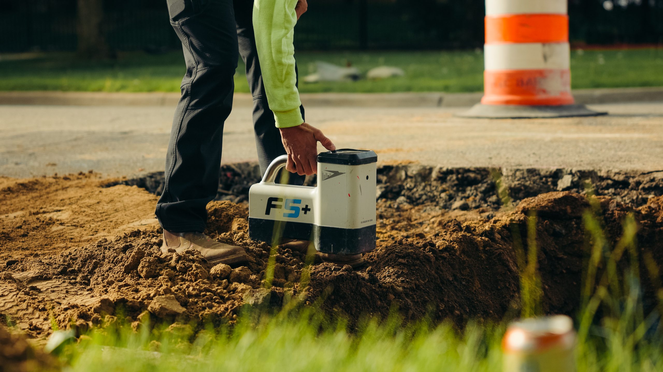 Atlas HDD crew member locating utilities on a directional drilling jobsite in Michigan